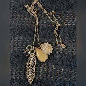 Gold necklace with charms